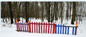 wood snow fence with colors